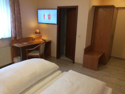 Ein Bett oder Betten in einem Zimmer der Unterkunft Adesso Hotel Göttingen - pay at property on arrival-Ihr Automatenhotel in Göttingen