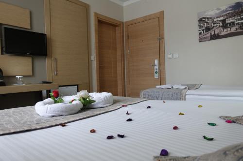 Katil atau katil-katil dalam bilik di Otel Mutevelli