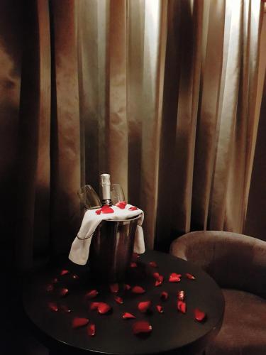 a table with a drink and hearts on it at The Enniskillen Hotel and Motel in Enniskillen