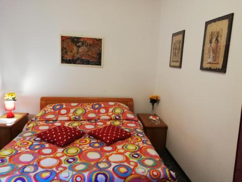 a bed with two pillows on it in a bedroom at Venice Best Vacation in Marghera