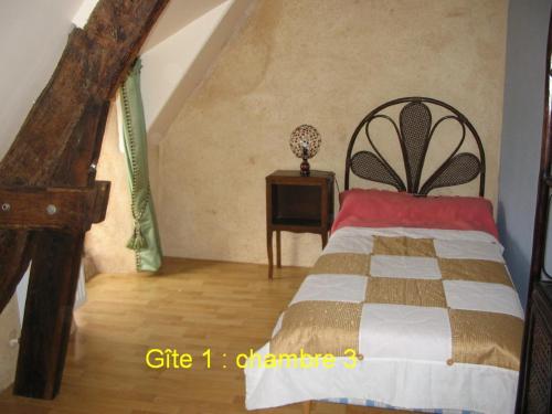 מיטה או מיטות בחדר ב-Gites du ROHERAN