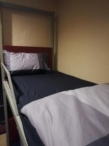 a bedroom with two beds in a room at Bike&Bed in Thakhek