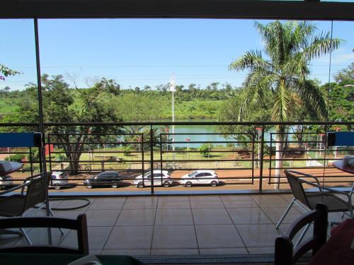 a balcony with a view of a parking lot at Pousada Beira Rio in Itumbiara