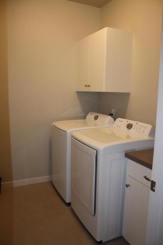 a small white laundry room with a washer and dryer at 11203 Arch in Boise