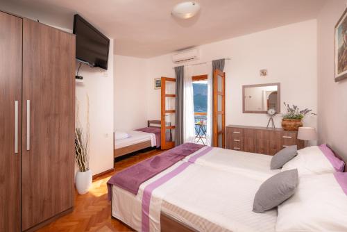 Postel nebo postele na pokoji v ubytování Holiday Home Jelena