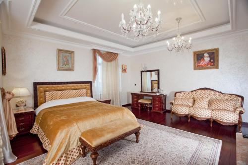 En eller flere senge i et værelse på Bortnichi House