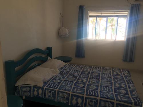 Кровать или кровати в номере Vista pro mar maravilhosa,Tibau-RN