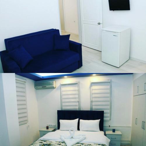 a blue couch and a bed in a room at ECS Suw Hotel in Atakum