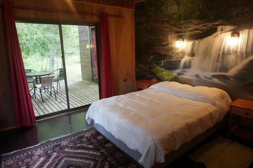 Postel nebo postele na pokoji v ubytování Ecoreserva Quelhue Lodge y Cabañas