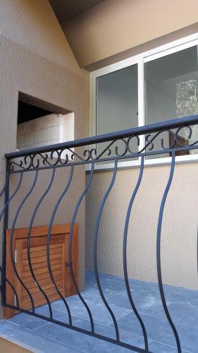 a metal railing in front of a window at Apto Studio in Nova Petrópolis