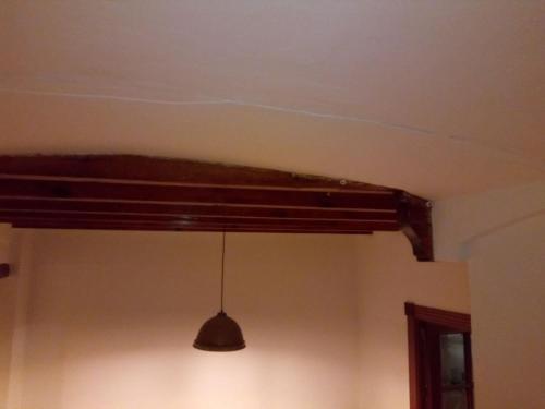 aendant light hanging from a ceiling in a room at Casa Rosalía in Ibi