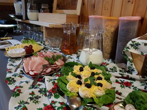 a table with some food on top of it at Antonówka in Trybsz