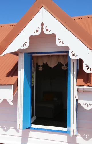 awning over a porch of a house at Casa la Colline in Vieux-Fort