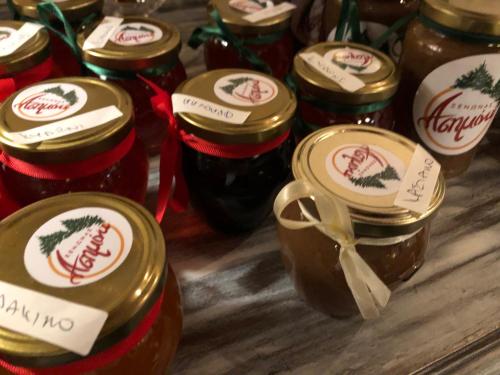 a group of jars of jam on a table at Asimina Guesthouse, Eptalofos Parnassos in Eptalofos