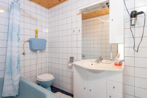 a bathroom with a sink and a toilet and a tub at Apartments Mato Oborović Papica in Orebić