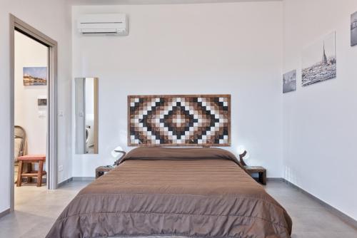 Кровать или кровати в номере Attico Valentino Cellini