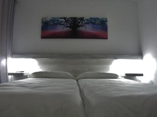 Cama o camas de una habitación en Hostal Casa Palmira
