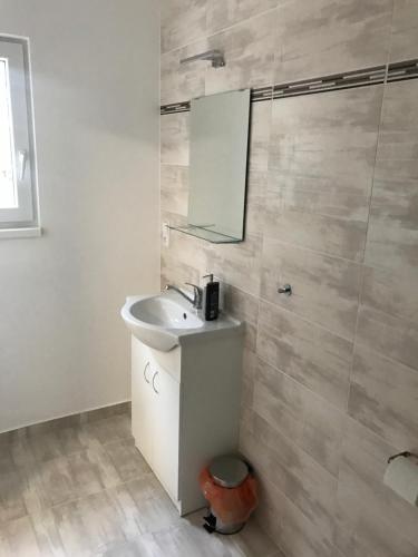 a bathroom with a sink and a mirror at Apartment Šarka in HoÅ¡Å¥ka