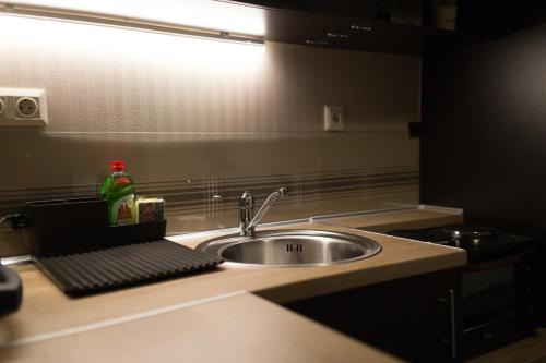Una cocina o cocineta en MARGARITA'S SUITES