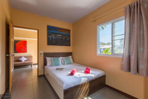 Säng eller sängar i ett rum på Samui Star Guesthouse