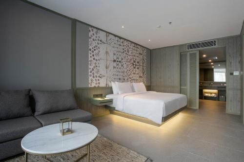 Postel nebo postele na pokoji v ubytování Kanvaz Village Resort Seminyak