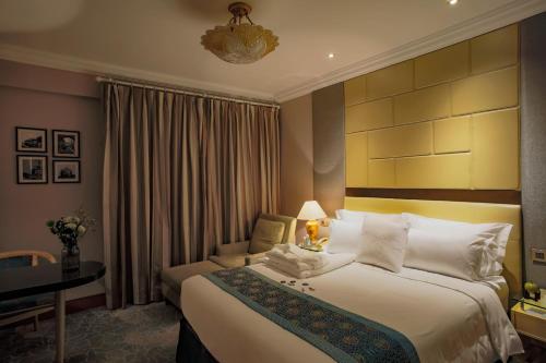 Posteľ alebo postele v izbe v ubytovaní Anting Villa Hotel
