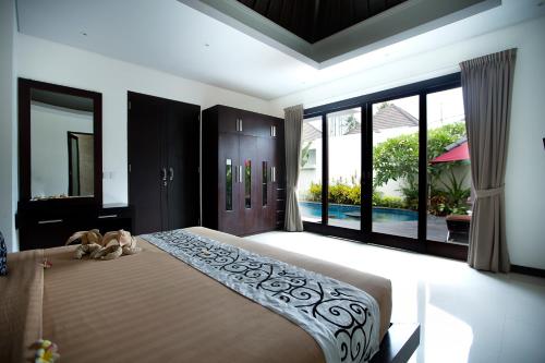 Postel nebo postele na pokoji v ubytování D&G Villas Nusa Dua