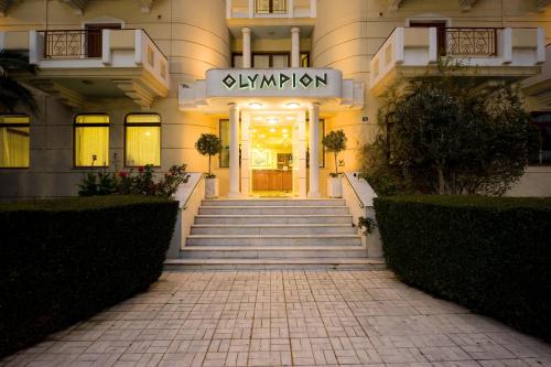 a building with a staircase leading to the front door at Olympion in Athens