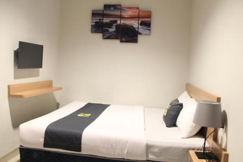 Ένα ή περισσότερα κρεβάτια σε δωμάτιο στο Ghurfati Hotel Mangga Besar