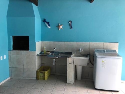 a bathroom with a sink and a toilet at Casa Porto Belo in Porto Belo