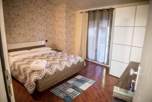 Postel nebo postele na pokoji v ubytování Hotel Lonatino