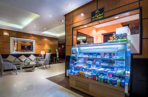 a store with a refrigerator filled with lots of drinks at Al Muhaidb Al Takhassosi Abaqrino in Riyadh