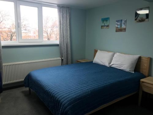 Postel nebo postele na pokoji v ubytování Dudman Hotel