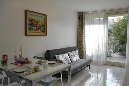 a living room with a couch and a table at Poggio ai Vigneti in Entratico