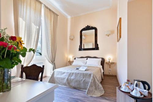 A bed or beds in a room at Vatican Domus Luxury Rooms