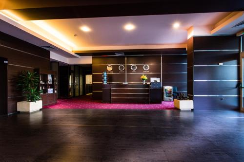 a lobby of a hotel with a reception desk at Hemus Hotel - Vratza in Vratsa