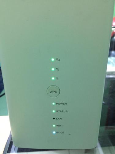 a wii remote control with a bunch of green lights at DAOH'S Rooms & Scooters in Tanjung Rhu 