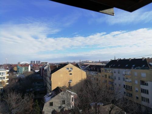a view of a city with buildings and a blue sky at Two Kings apartment in Novi Sad