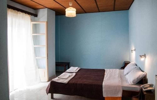 Postel nebo postele na pokoji v ubytování APRAOS BAY HOTEL