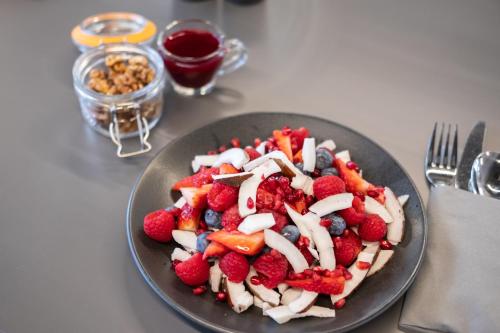 a plate of fruit salad on a table at Elite Athlete Centre and Hotel in Loughborough