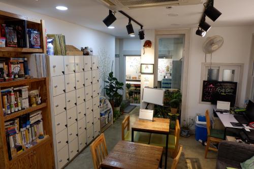 a room with a desk and a table in a room at Haru The Guesthouse in Andong