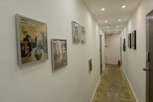 a hallway with pictures on the walls of a museum at Haru The Guesthouse in Andong