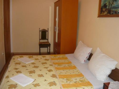 En eller flere senger på et rom på Rooms Banićević