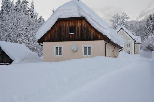 a house with a snow covered roof at Haus Rosina in Admont