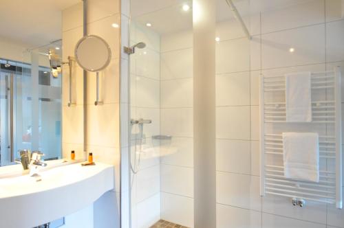 Kylpyhuone majoituspaikassa Hotel im Wigbold