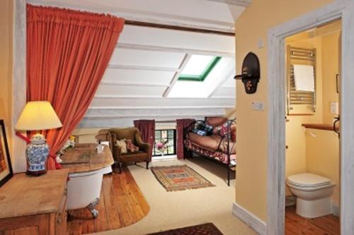 a living room with a couch and a window at Alnwick Lodge West Cawledge Park in Shilbottle