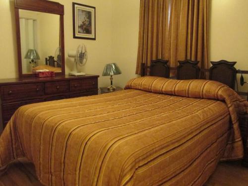 Postelja oz. postelje v sobi nastanitve Comerford's Ocean View Suites