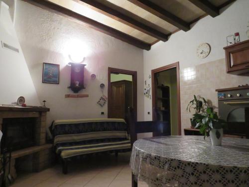 a living room with a couch and a table at Agriturismo Oddone in Bardineto