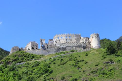 a castle on top of a hill at Pension & Residence Astoria in Prato allo Stelvio