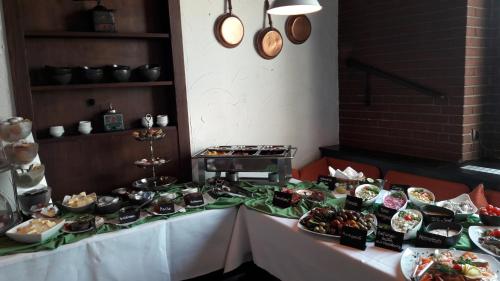 a table with many different types of food on it at Haus Bergmann in Harsewinkel